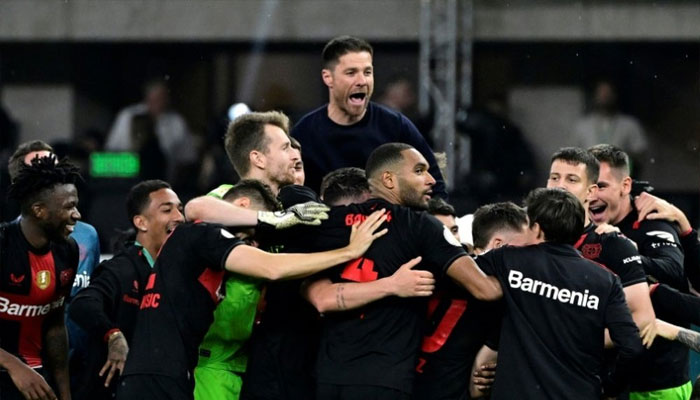 Leverkusen players celebrating after winning the German Cup by defeating Kaiserslautern 1-0. AFP/file
