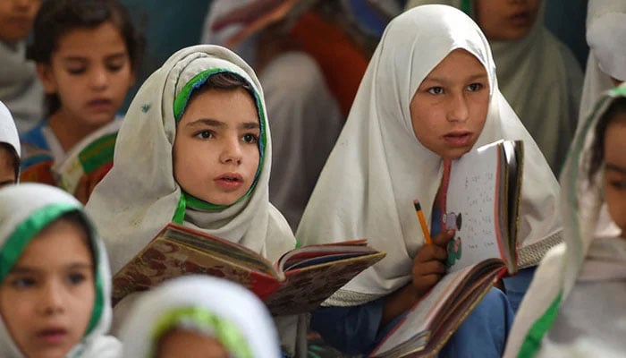 This picture shows girls attending a class in Mingora, a town in Swat Valley. — AFP/File