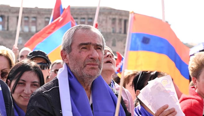 Armenians rally to demand Prime Minister Nikol Pashinyans resignation over land transfer to neighboring Azerbaijan, at the central Republic Square in Yerevan on May 26, 2024.— AFP