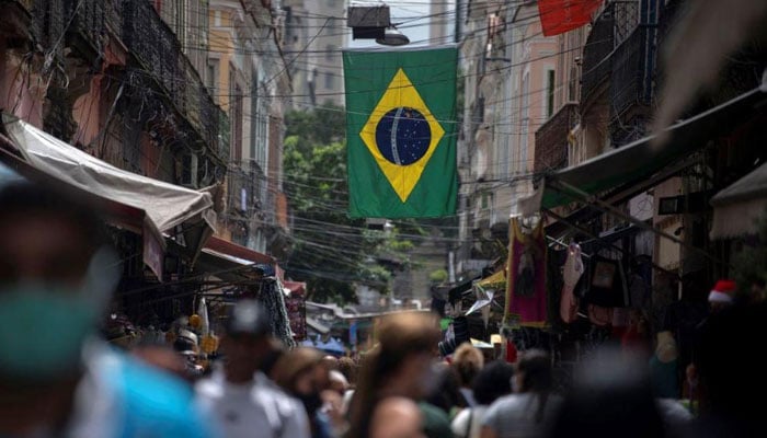 People walk at Saara market in downtown Rio de Janeiro. — AFP