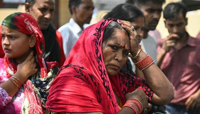 Relatives of infant victims gesture as they wait to identify them a day after a fire broke out at a children’s hospital in New Delhi on May 26, 2024. — AFP