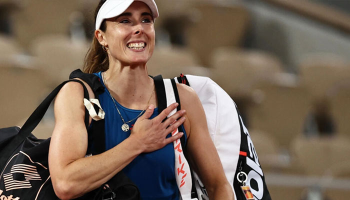 Alize Cornet gesutures at a tennis court. — AFP/file