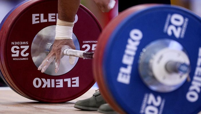 A representational image of a weightlifter lifting weights during a competition. — AFP/File
