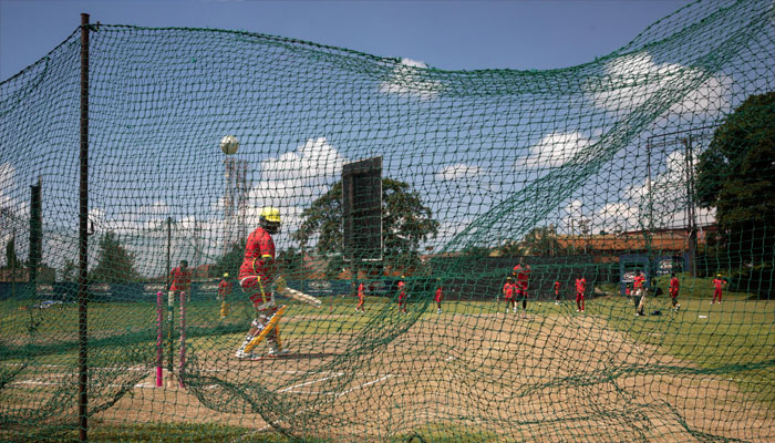 Batsman Kenneth Waiswa training at the Kampala cricket ground. — AFP/file
