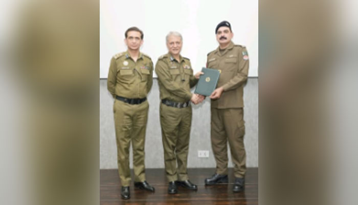 IG Punjab Dr Usman Anwar awards a certificate to a police officer on May 27, 2024. — Facebook/Punjab Police Pakistan