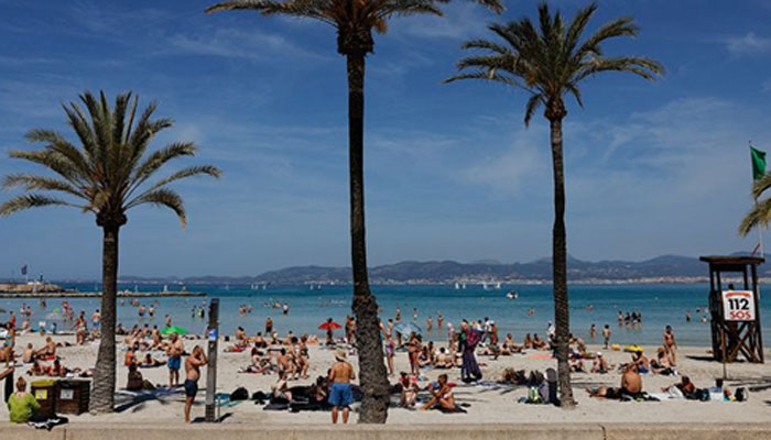 Tourists at the El Arenal beach in Palma de Mallorca, Spain. — Reuters/file