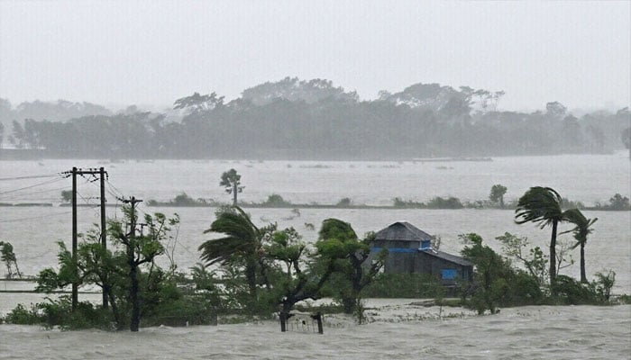 Marooned houses are seen during heavy rainfall in Patuakhali on May 27, 2024, following the landfall of Cyclone Remal in Bangladesh. — AFP