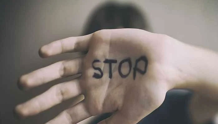 Representational image of a girl highlighting resistance agaisnt sexual abuse with stop written on her hand. — Unsplash/File