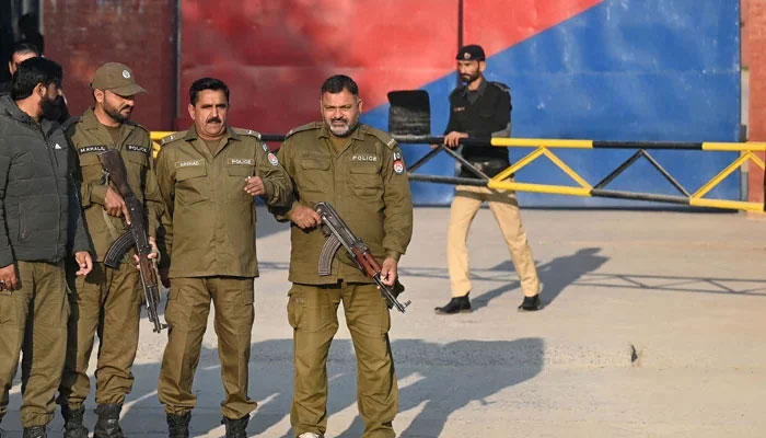 This image shows Punjab police personnel standing alert outside a jail. — AFP/File