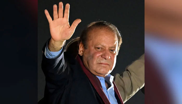 Former prime minister Muhammad Nawaz Sharif waves to his supporters gathered at a park during an event held to welcome him in Lahore on October 21, 2023. — AFP