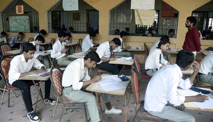 Students of matric class solves paper in examination center during Annual Examination of Matriculation in Karachi on May 29, 2024. — PPI