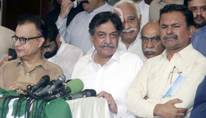 Grand Democratic Alliance (GDA) Senior Leader, Pir Sadaruddin Shah Rashidi (C) along with others speak to media persons during press conference in Karachi on May 29, 2024. — PPI