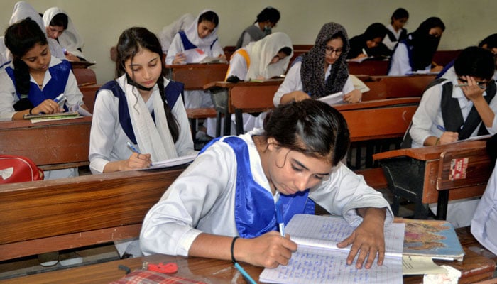 Students solves question paper during annual examination of HSSC part II 2024 (Class XII) Hyderabad on May 29, 2024. — APP