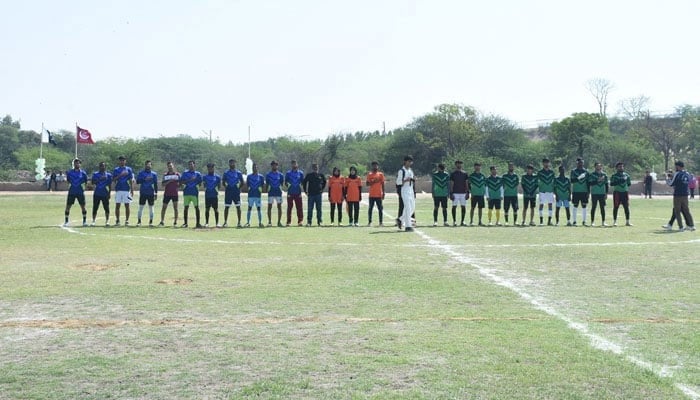 A representational image of two football teams posing for a photo during the Karachi University Interdepartmental Sports Gala. — Facebook/uoktimes/File