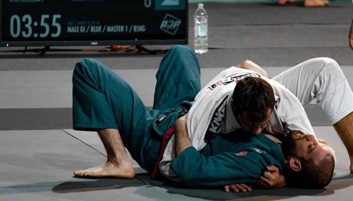 A representational image showing two people engaged in a duel during a martial arts match. — Unsplash