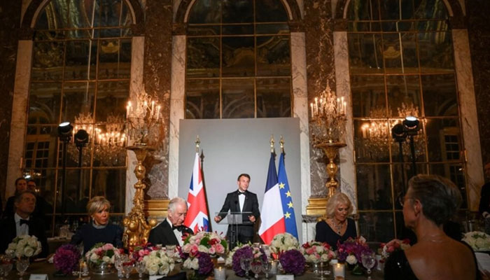 A representational of French President Emmanuel Macron speaking at a state dinner for UKs King Charles III at Versailles. — AFP/file