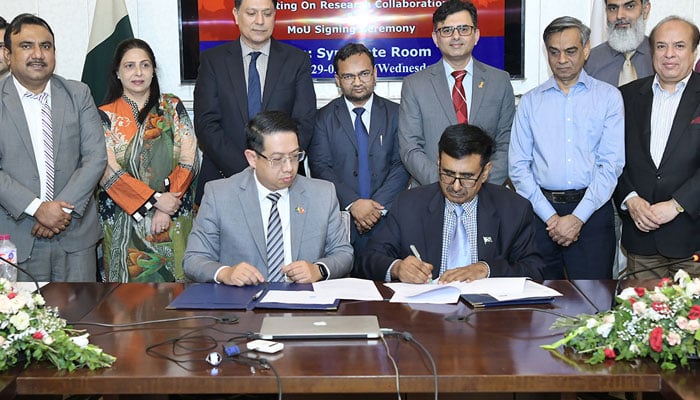 Officials of UVAS sign an MOU with a private company in this image on May 30, 2024. — Facebook/UVAS