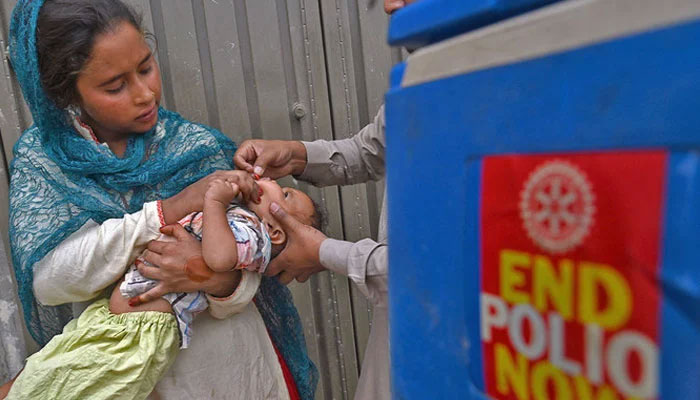 A polio team administers polio vaccine to a child. — AFP/File