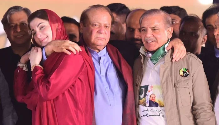 (L to R) PML-N leaders including Punjab CM Maryam Nawaz, party President Nawaz Sharif and PM Shehbaz Sharif at the stage during a rally at Minar-e-Pakistan in Lahore, on October 21, 2023, in this still taken from a video. — X@pmln_org