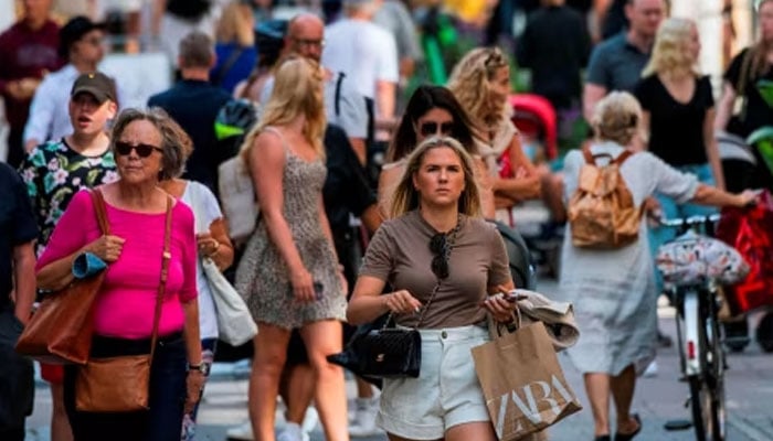 A representational image of people walking in a market in Swedens capital Stockholm. — AFP/File