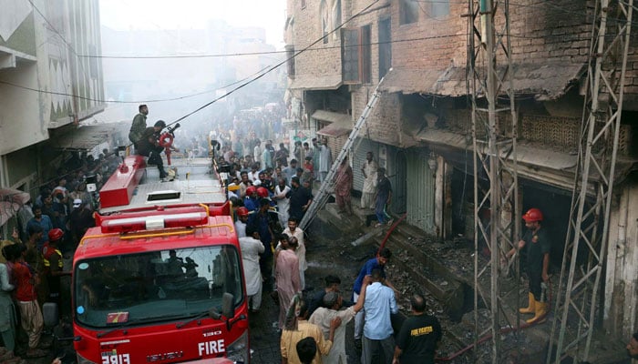 Fire brigade officials extinguish a fire at the Paretabad area in Hyderabad on May 30, 2024.  —PPI