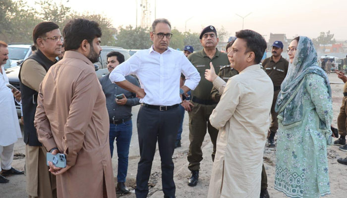 Commissioner Lahore Zaid Bin Maqsood is being briefed by officials on the LDAs Controlled Access Corridor Project on June 1, 2024. — Facebook/Commissioner Lahore,Punjab.