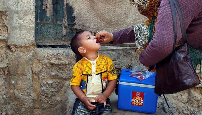 A boy receives polio vaccine drops during an anti-polio campaign in Karachi. — Reuters/file