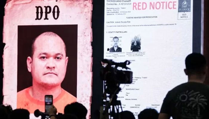 A monitor shows Thai fugitive Chaowalit Thongduang during a press conference after he was arrested by Indonesian police in Bali at the National Police Criminal Investigation Agency (BARESKRIM) office in Jakarta on Jun 2, 2024. — AFP