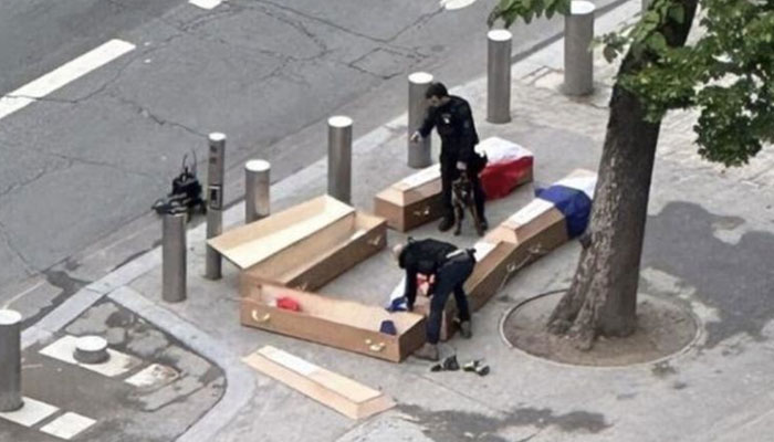 A photo of the five coffins found near Eiffel Tower in Paris, draped in French flags with the inscription “French soldiers in Ukraine”.— X@johnwiskers324/file