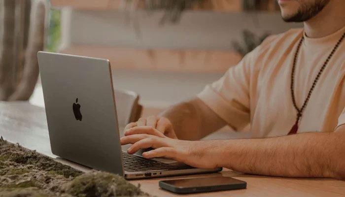 A representational image of a person using a laptop. — Pexels