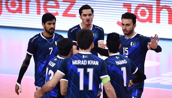 The Pakistan volleyball team players celebrate after scoring a point. — PVF/File