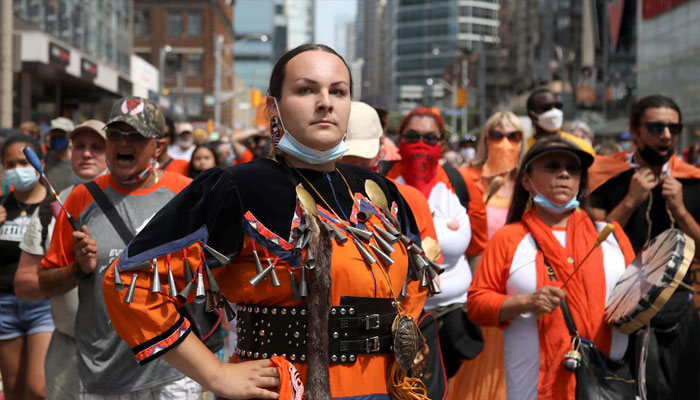 Indigenous performer Danielle Migwans attends a march after the discovery of hundreds of remains of children at former indigenous residential schools, on Canada Day in Toronto, Ontario, Canada July 1, 2021. — Reuters