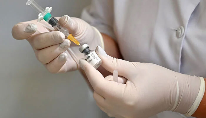 A representational image of a nurse preparing a vaccine to be administered to a patient. — AFP/File