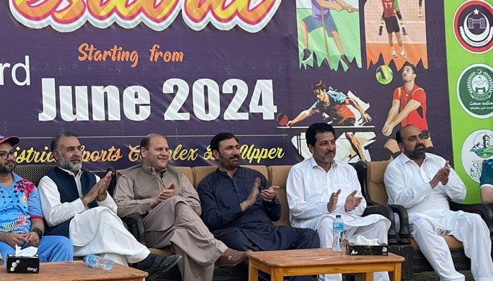 MNA Sahibada Sabghatullah (C), MPA Anwar Khan (L) and Deputy Commissioner Irfan Ali (2nd L ) clapping during a six-day inter-departmental sports festival at the Dir Sports Complex, this image released on June 4, 2024. — Facebook/Sahibzada Sibghatullah