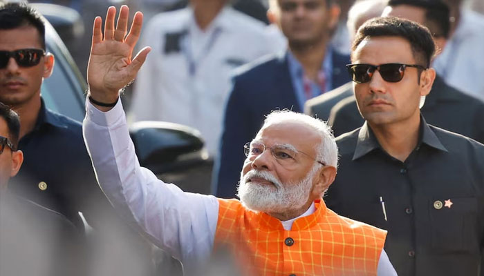 Indias Prime Minister Narendra Modi waves on the day he votes during the third phase of the general election, in Ahmedabad, India, May 7, 2024. — Reuters