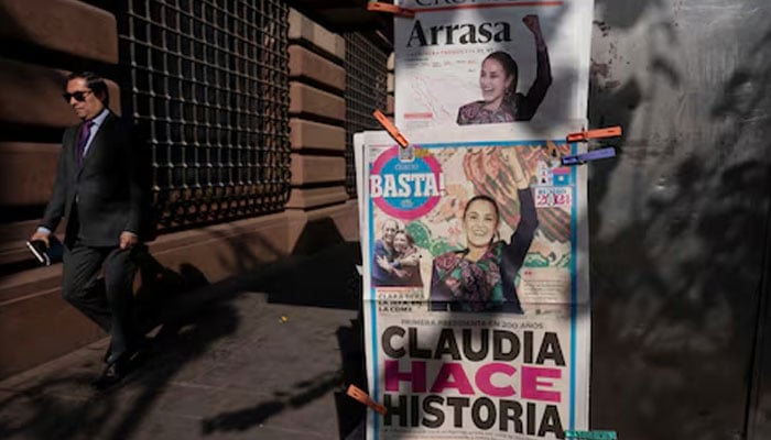 A man walks past newspapers displaying the victory of the presidential candidate of the ruling Morena party Claudia Sheinbaum, a day after the general election, in Mexico City, Mexico June 3, 2024. — Reuters