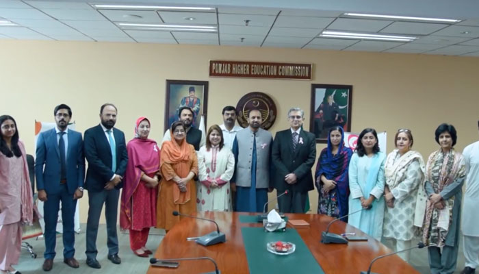 Participants pose for a group photo during a signing ceremony of an MoU between Pink Ribbon Pakistan and six womens universities of Punjab on June 6, 2024. — Screengrab via Facebook/Punjab Higher Education Commission-PHEC