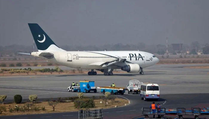 A Pakistan International Airlines (PIA) plane prepares to take off at Alama Iqbal International Airport in Lahore.  — Reuters/File