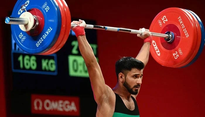 Pakistans Talha Talib is seen lifting weights as part of  a competition related to Tokyo Olympics 2020. — Reuters/File