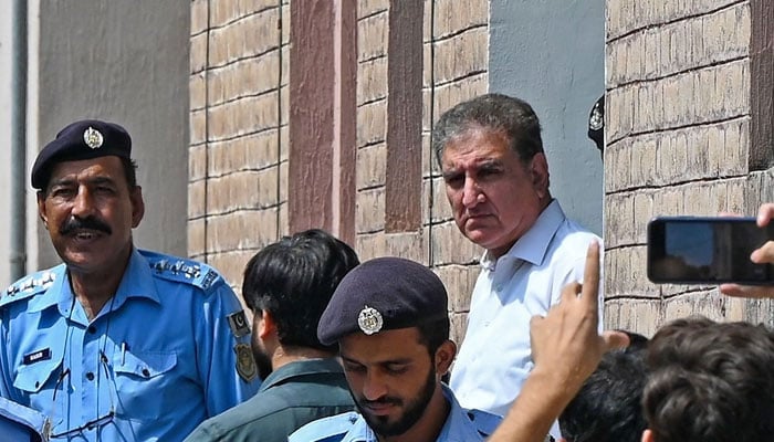 PTI leader Shah Mahmood Qureshi and former foreign minister is seen outside a special court after he was granted a four-day physical remand in Islamabad on August 21, 2023. — AFP