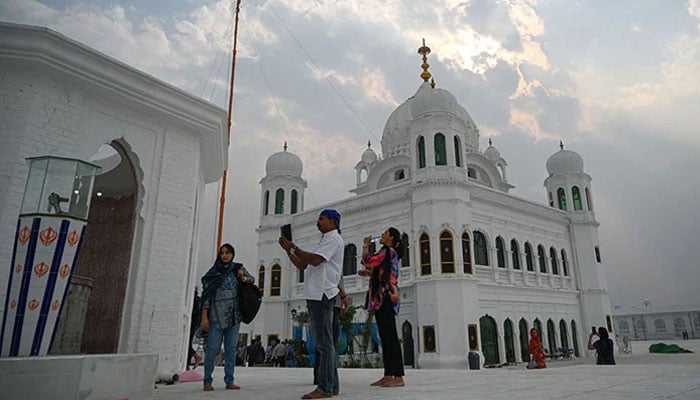 Sikh pilgrims from different countries visit the Shrine of Baba Guru Nanak Dev at the Gurdwara Darbar Sahib, in the Pakistani town of Kartarpur, near the Indian border, on November 6, 2019. — AFP