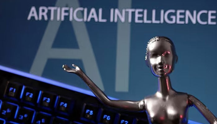 Artificial Intelligence words are seen written along with a robotic figure in this illustration taken, May 4, 2023. — Reuters