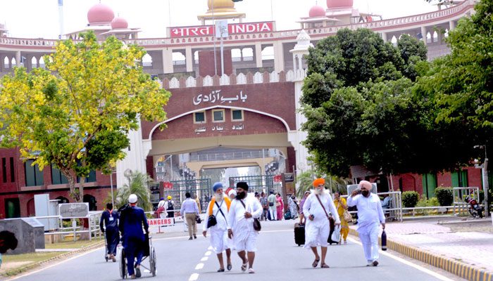 Sikh pilgrims cross into Pakistan from India at the Wagah border crossing under the leadership of Sardar Gurbachan Singh to participate in the Yatri celebrations in this image released on June 8, 2024. — APP