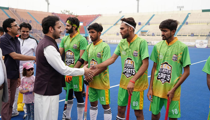 Punjab Minister for Youth Affairs Malik Faisal Ayub Khokhar shakes hands with hockey players during the Khailta Punjab event on June 6, 2024. — Facebook/Faisal Ayub Khokhar