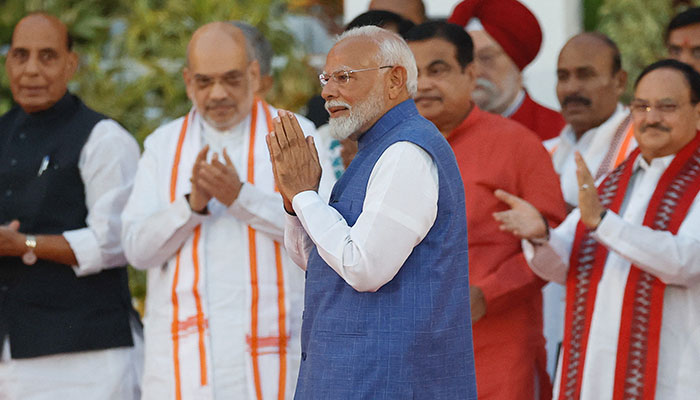 Indias Prime Minister Narendra Modi gestures during a swearing-in ceremony at the presidential palace in New Delhi, India, June 9, 2024. — Reuters