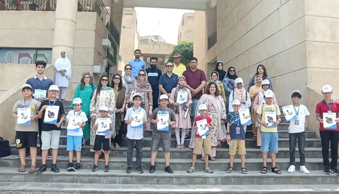 Students pose for a group photo along with their teachers during an event at Roots School System DHA-1 on June 6, 2024. — Facebook/Roots School System DHA-1 Flagship Campus Islamabad