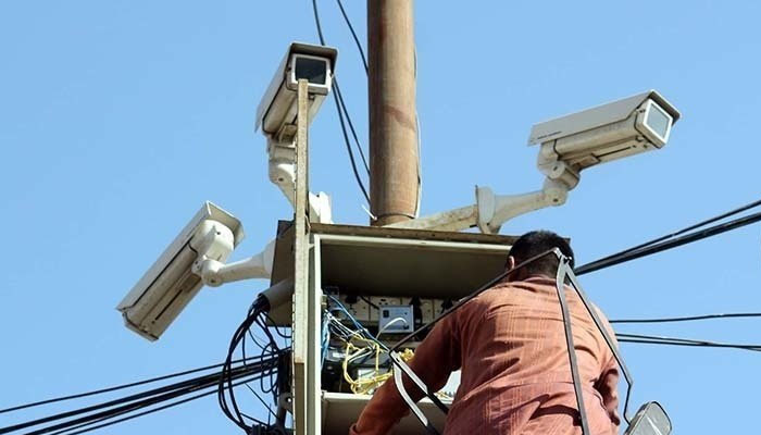 A representational image of a technician working on CCTV cameras installed at an undisclosed location in this undated image. — AFP/File