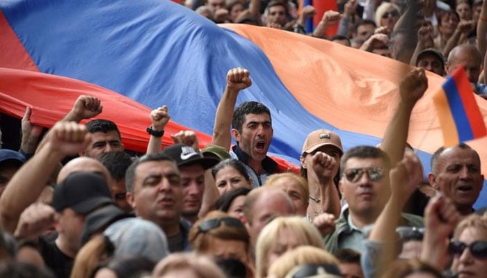 Demonstrators shout slogans as they attend an opposition rally in Yerevan on May 1, 2022, held to protest against Karabakh concessions.  — AFP
