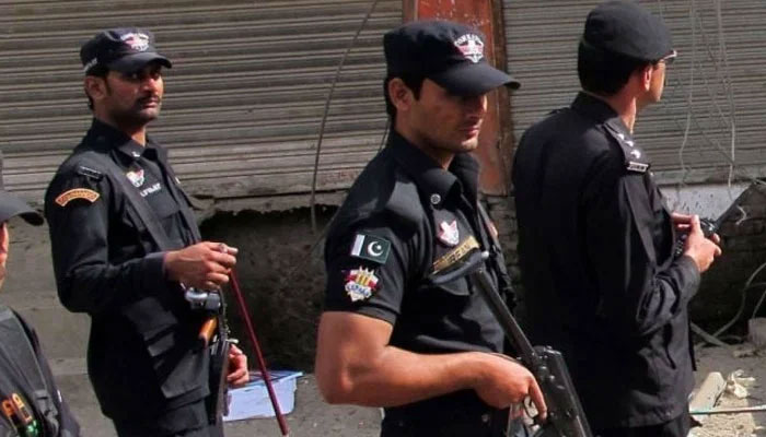 A representational image showing KP police personnel patrolling in an area after an attack in Swat. — AFP/File
