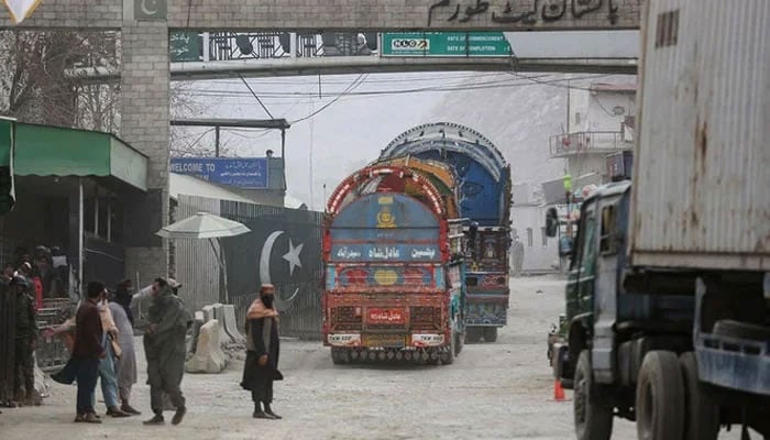 Trucks cross into Pakistan at the zero point Torkham border crossing between Afghanistan and Pakistan, in Nangarhar province on February 25, 2023. — AFP